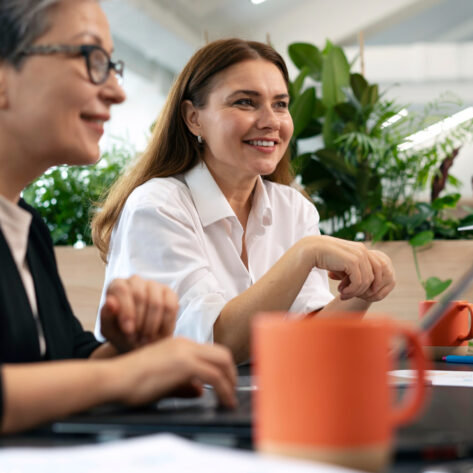 Employees using eco-friendly benefits in a California workplace