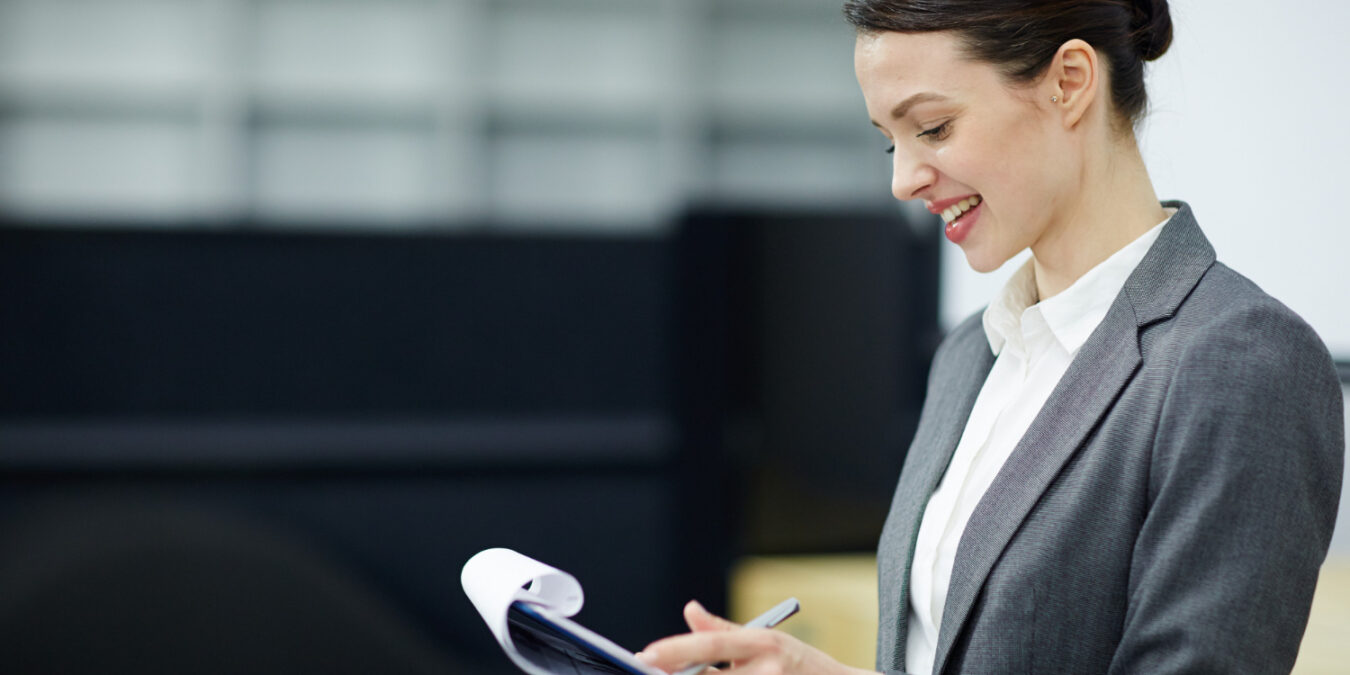 HR professional reviewing employee benefits compliance checklist for 2025