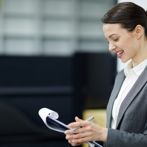 HR professional reviewing employee benefits compliance checklist for 2025