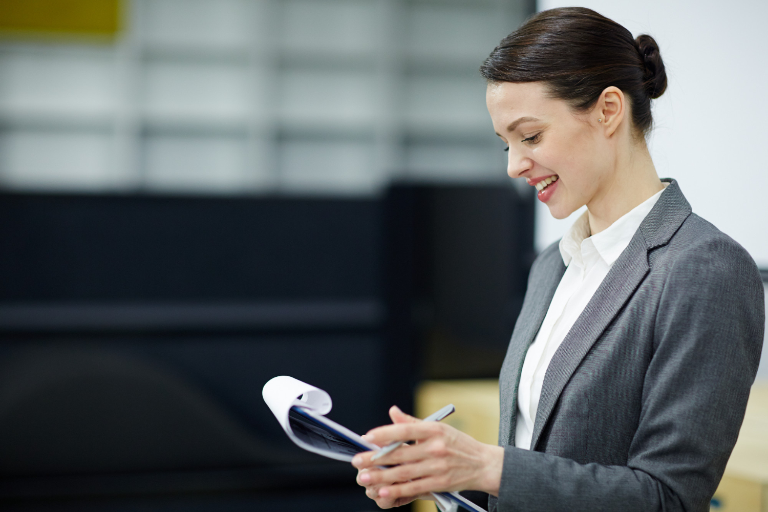 HR professional reviewing employee benefits compliance checklist for 2025