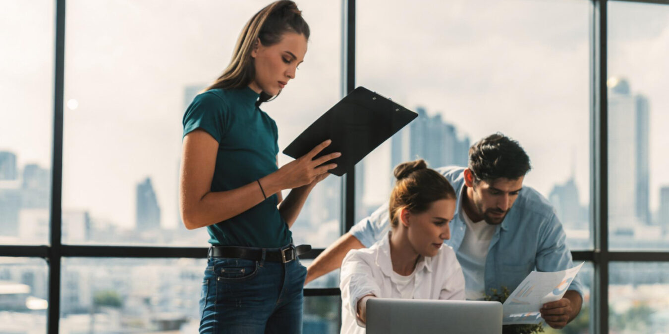 open enrollment checklist planning by HR team in office