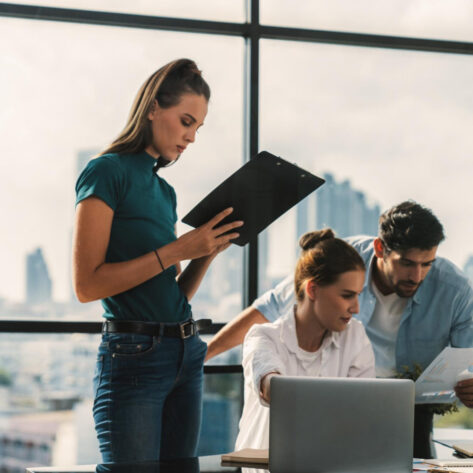 open enrollment checklist planning by HR team in office