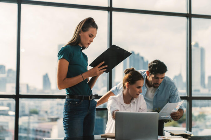 open enrollment checklist planning by HR team in office