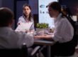HR team discussing how employee benefits influence employer brand reputation