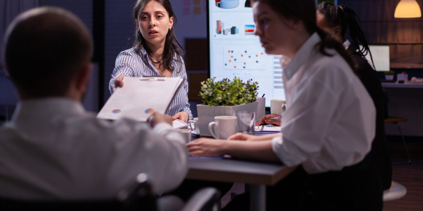 HR team discussing how employee benefits influence employer brand reputation
