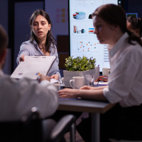HR team discussing how employee benefits influence employer brand reputation