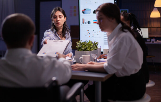 HR team discussing how employee benefits influence employer brand reputation