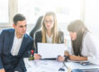 HR team conducting a mid-year benefits review for employers