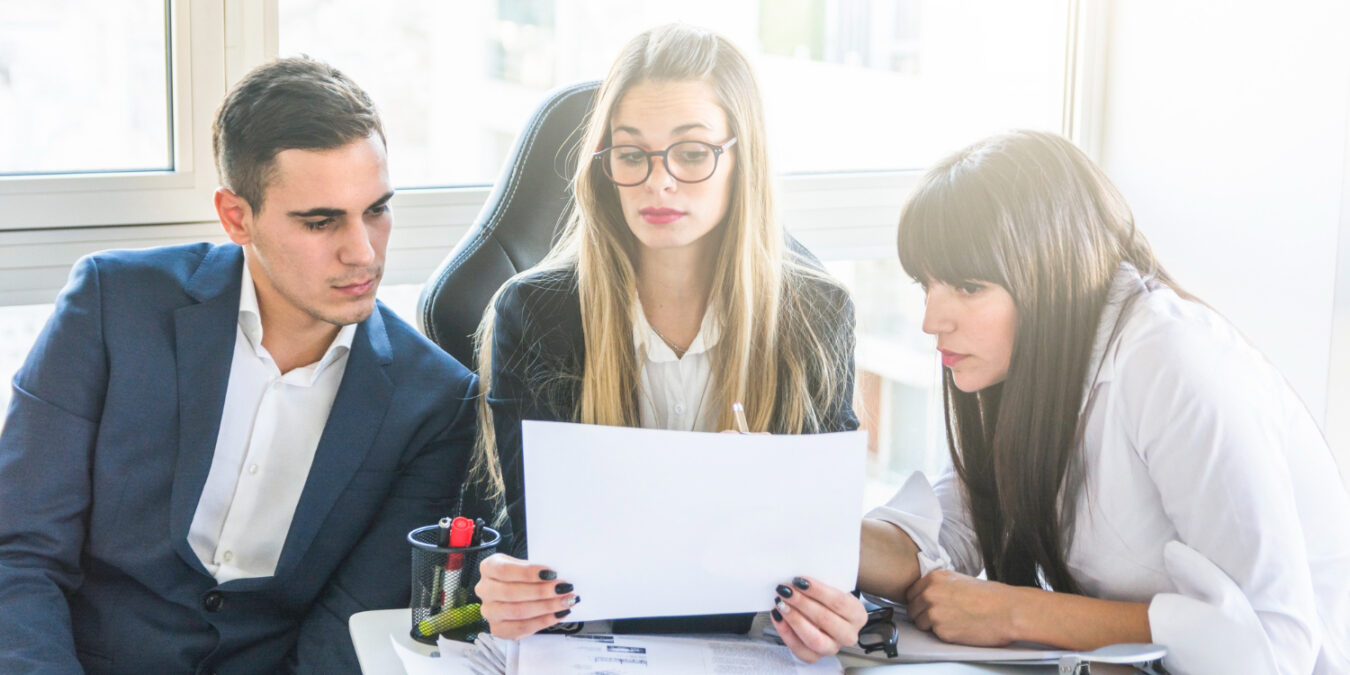 HR team conducting a mid-year benefits review for employers