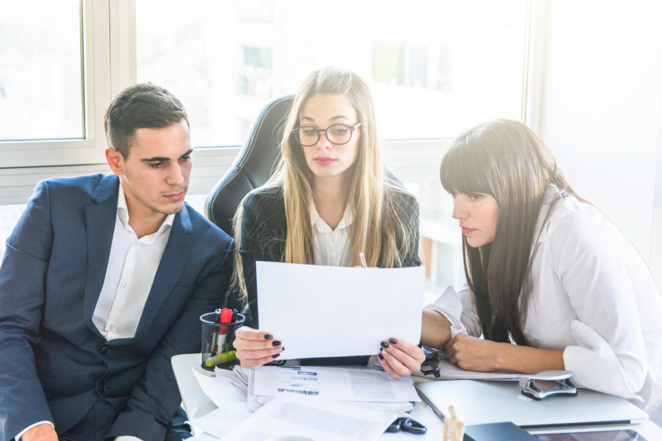 HR team conducting a mid-year benefits review for employers
