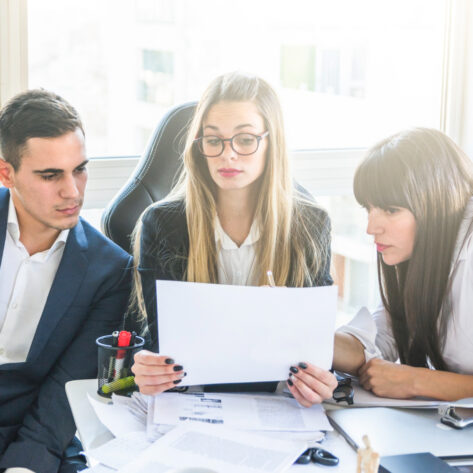 HR team conducting a mid-year benefits review for employers