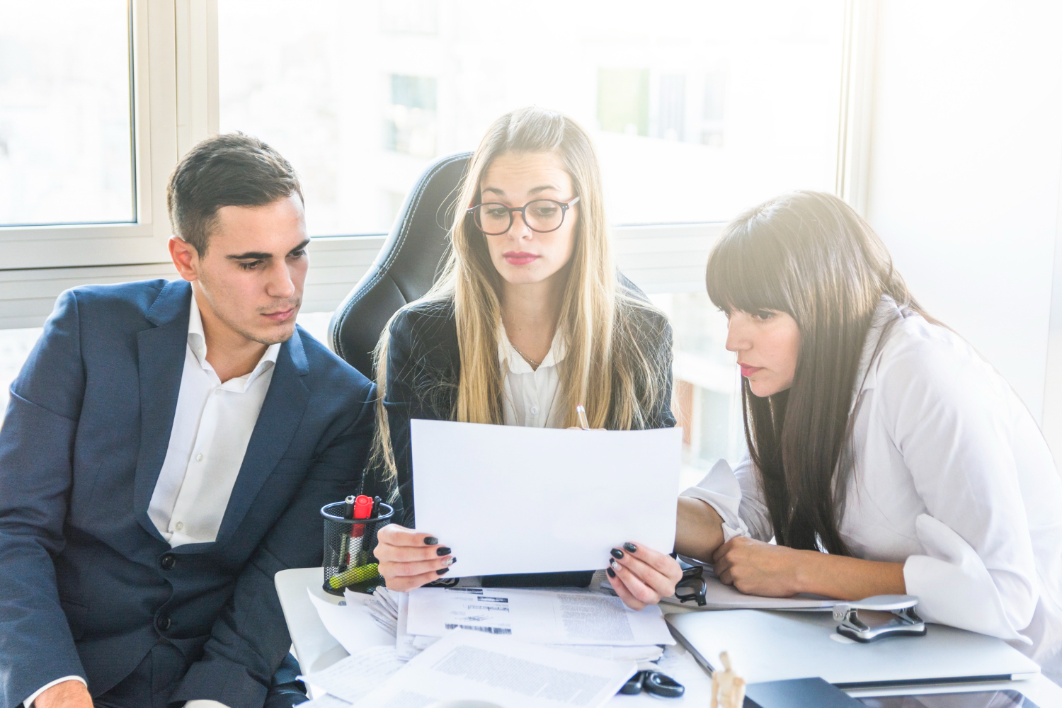 HR team conducting a mid-year benefits review for employers