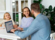 Working parent reviewing employee benefits and family leave options with HR