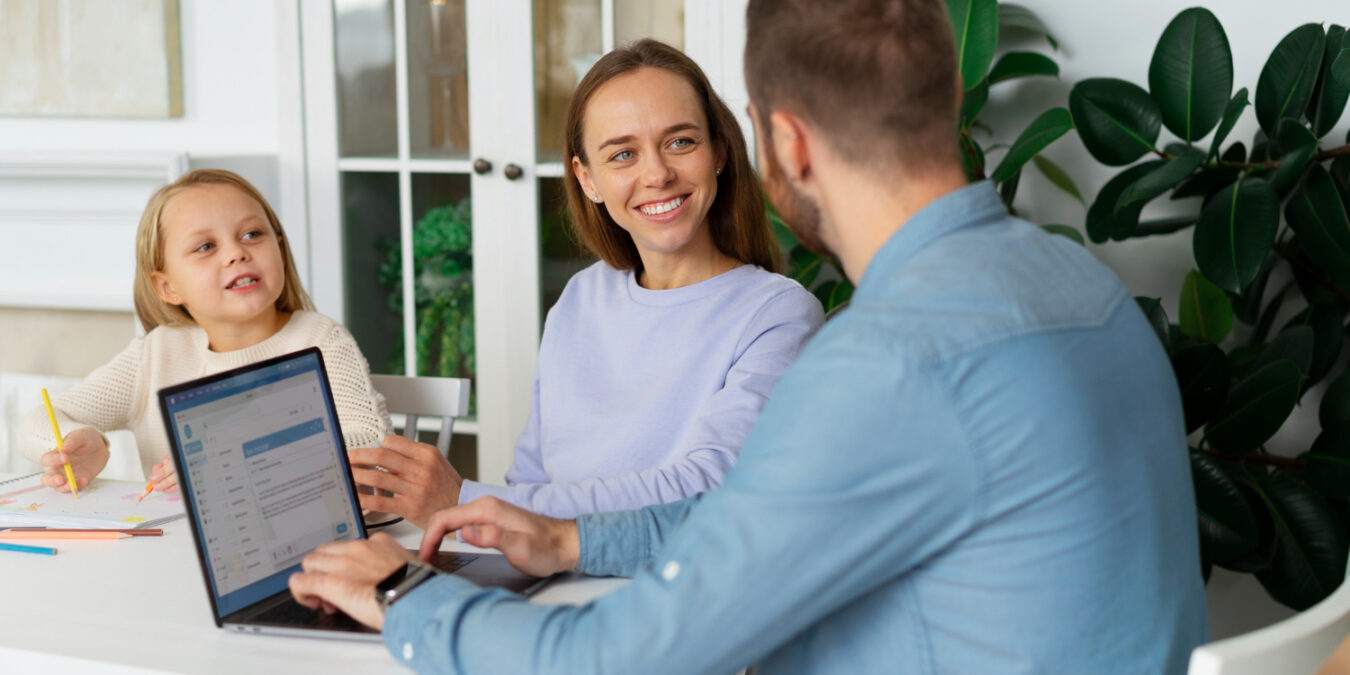 image-Benefits-for-Working-Parents-That-Matter Working parent reviewing employee benefits and family leave options with HR