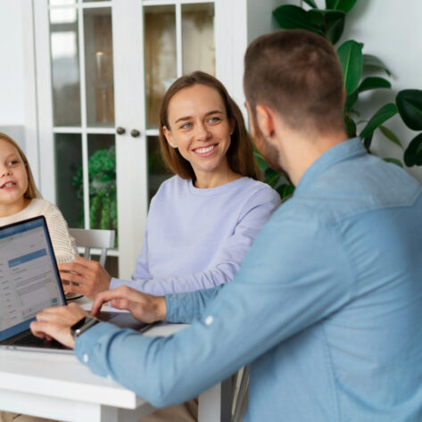 Working parent reviewing employee benefits and family leave options with HR