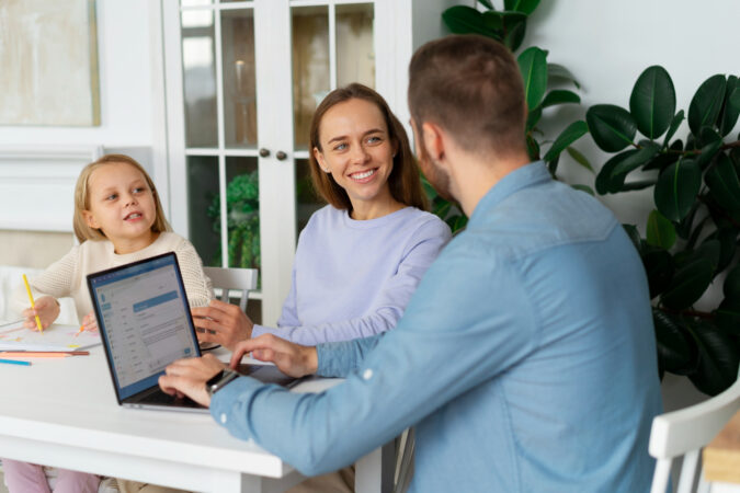 Working parent reviewing employee benefits and family leave options with HR