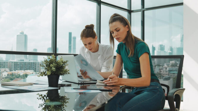 Employees reviewing why employee benefits matter in a compensation package
